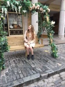 Photo of Monica Quirk sitting on a bench