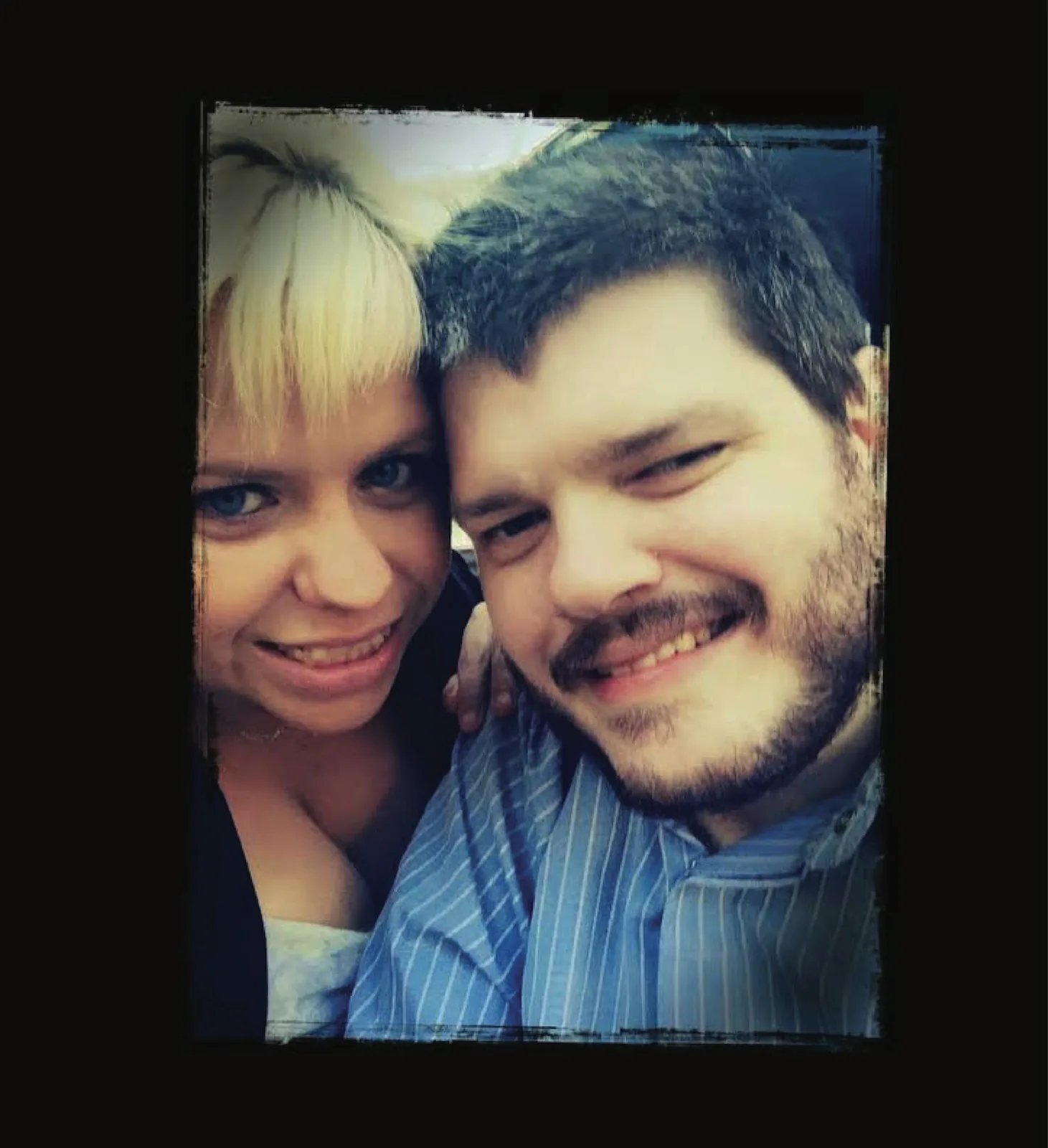 A couple smiling together in a photograph