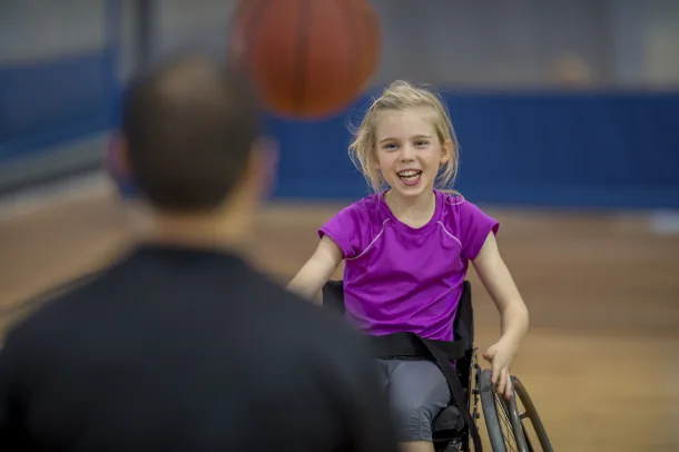 Girl playing wheelchair basketball