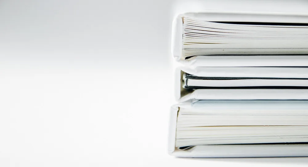 A stack of white documents