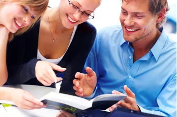 People looking at a document together