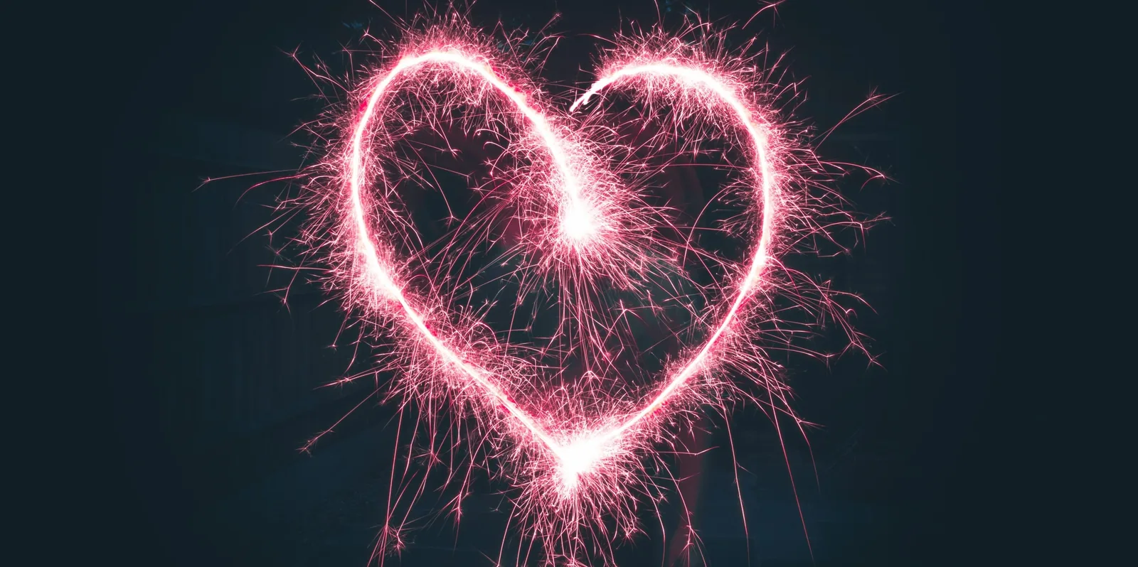 A heart shape drawn with a sparkler