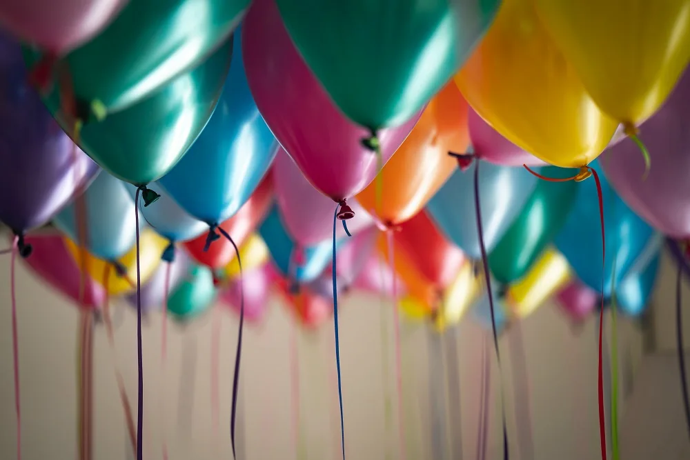 Colourful balloons with hanging ribbons