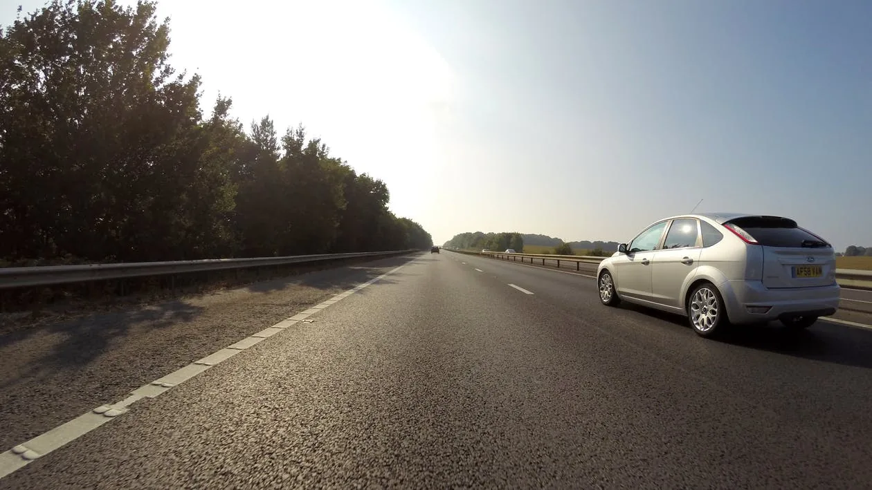 A car travelling along a road