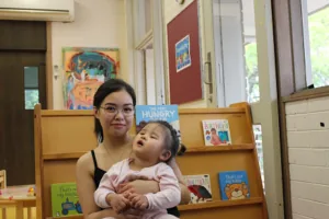 A mother holding her child.
