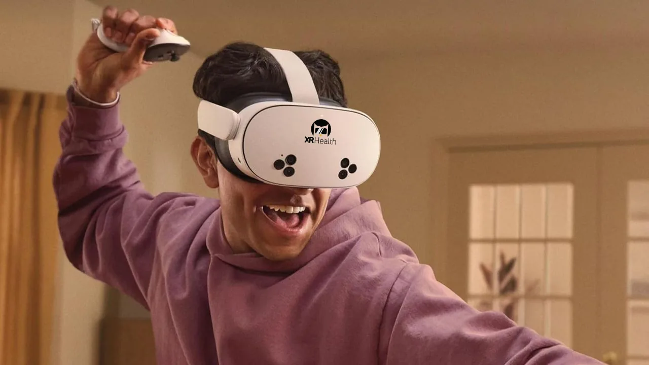 A young person wearing a VR headset and raising one hand