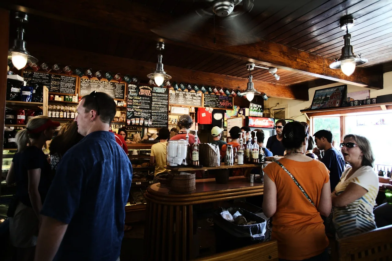 People seated at a busy cafe counter