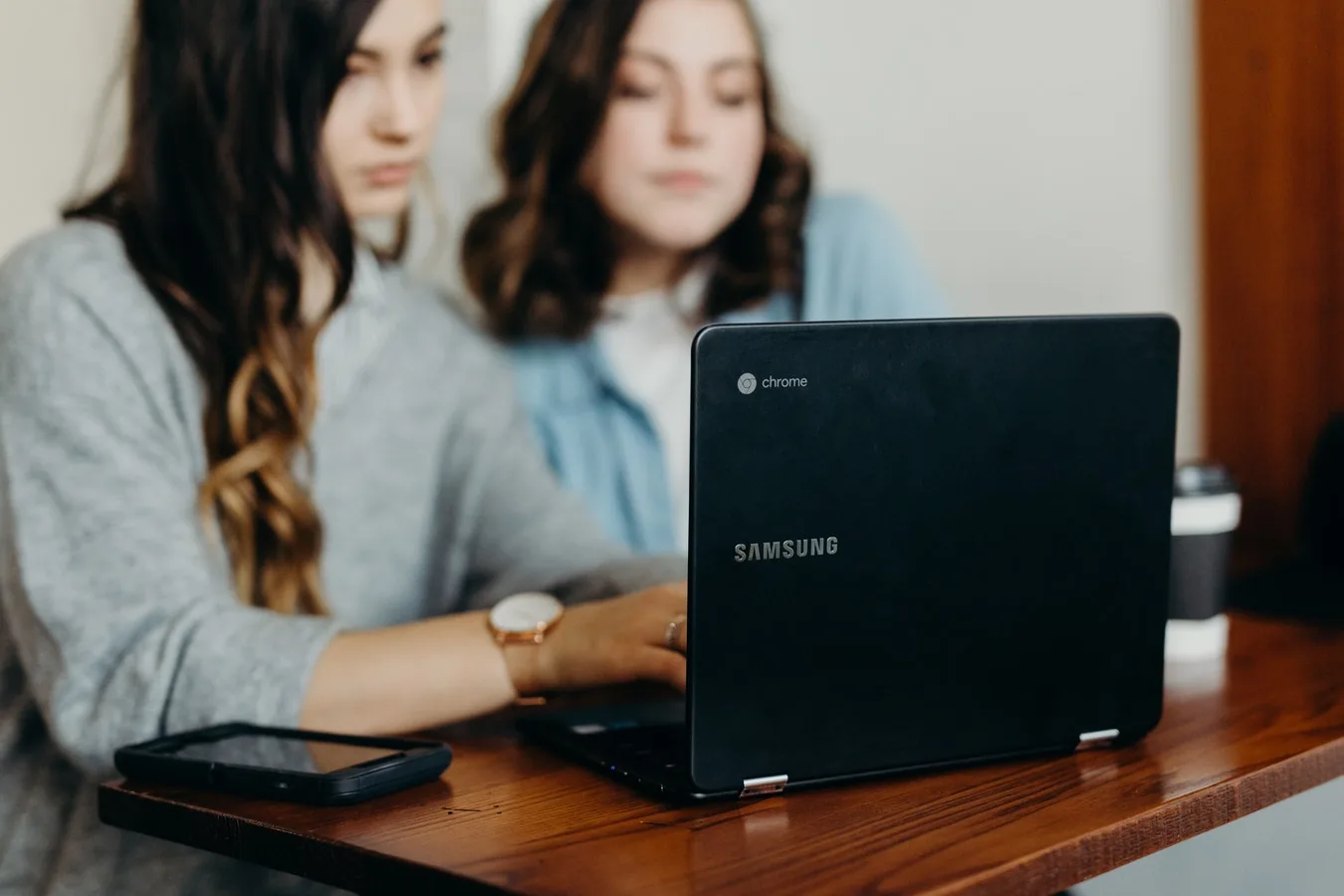 Two people looking together at a laptop