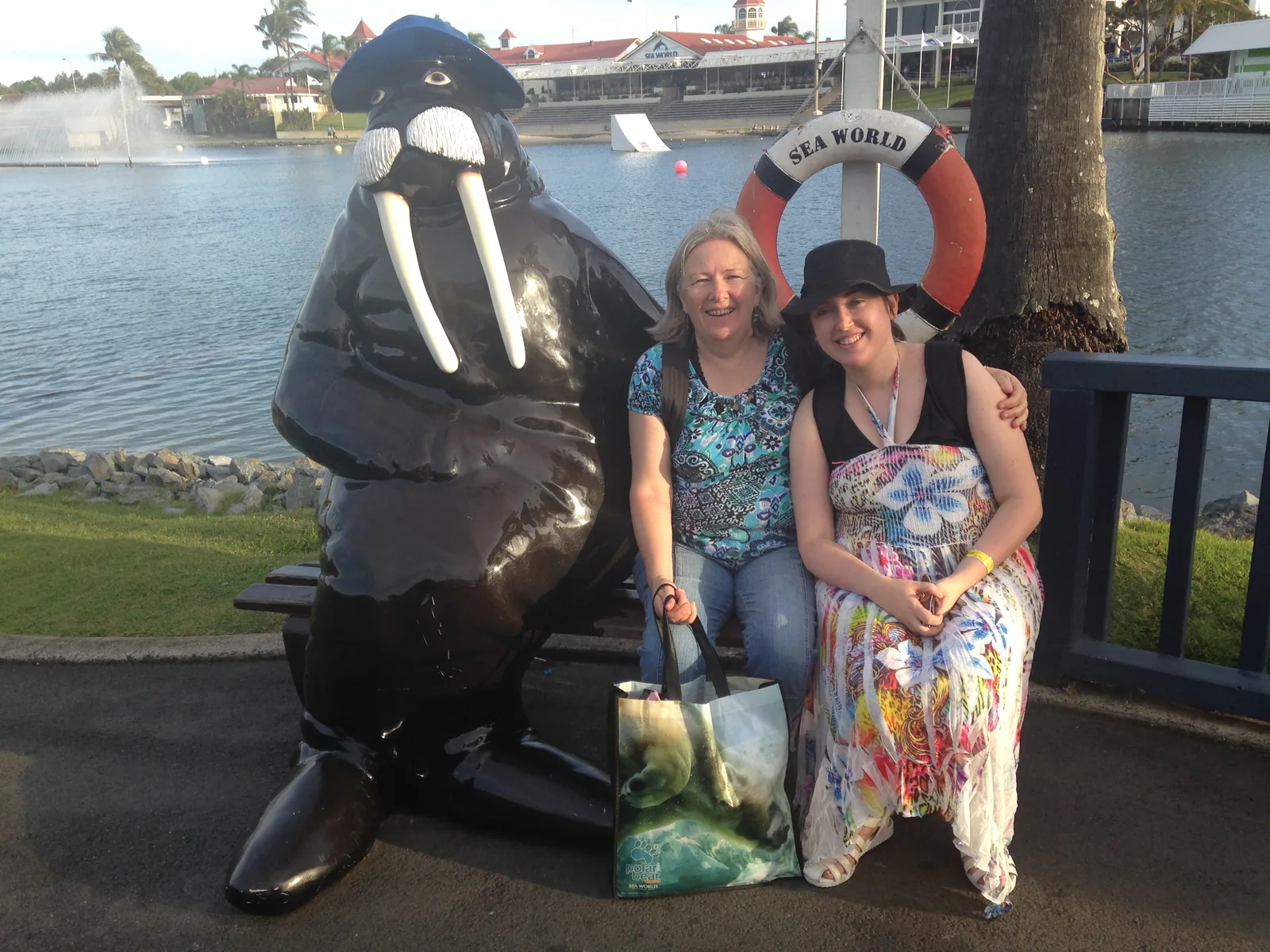 Alanna sitting on a park bench with her mother.