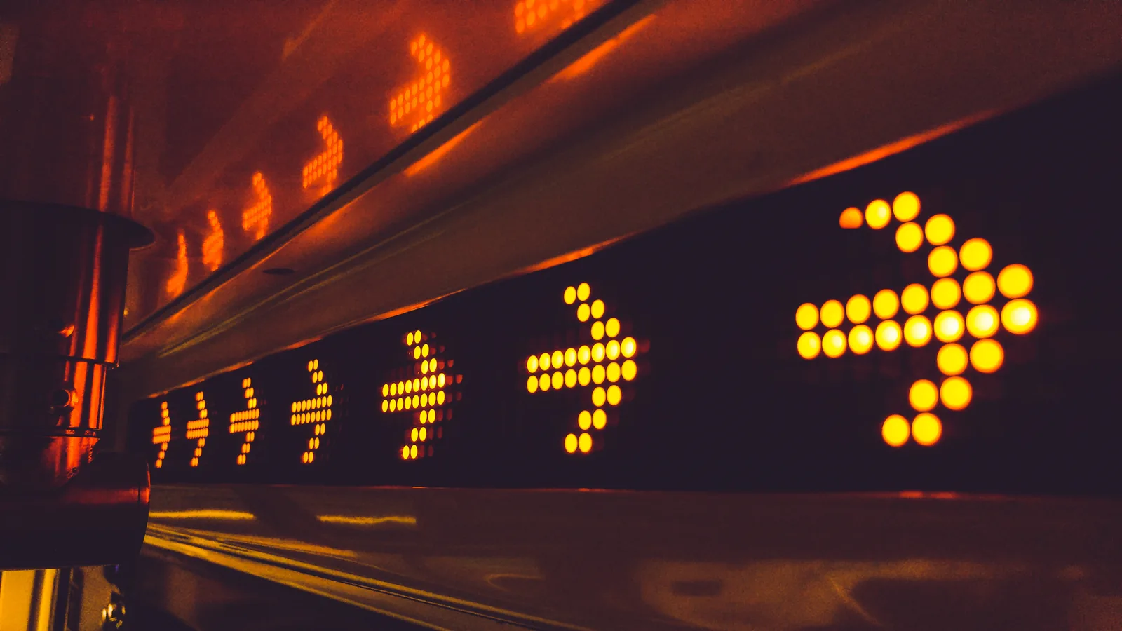 Illuminated arrows pointing towards the right