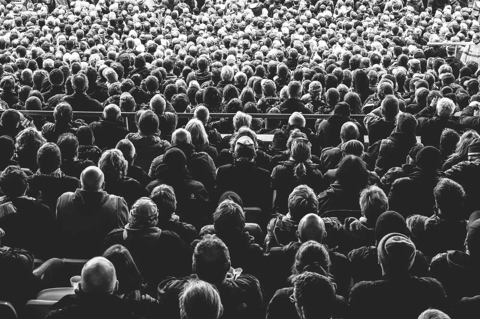 A large seated audience viewed from behind