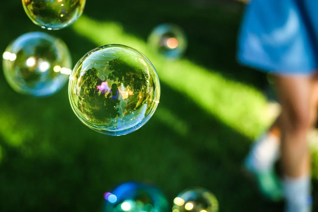 Soap bubbles floating in front of a blurred background