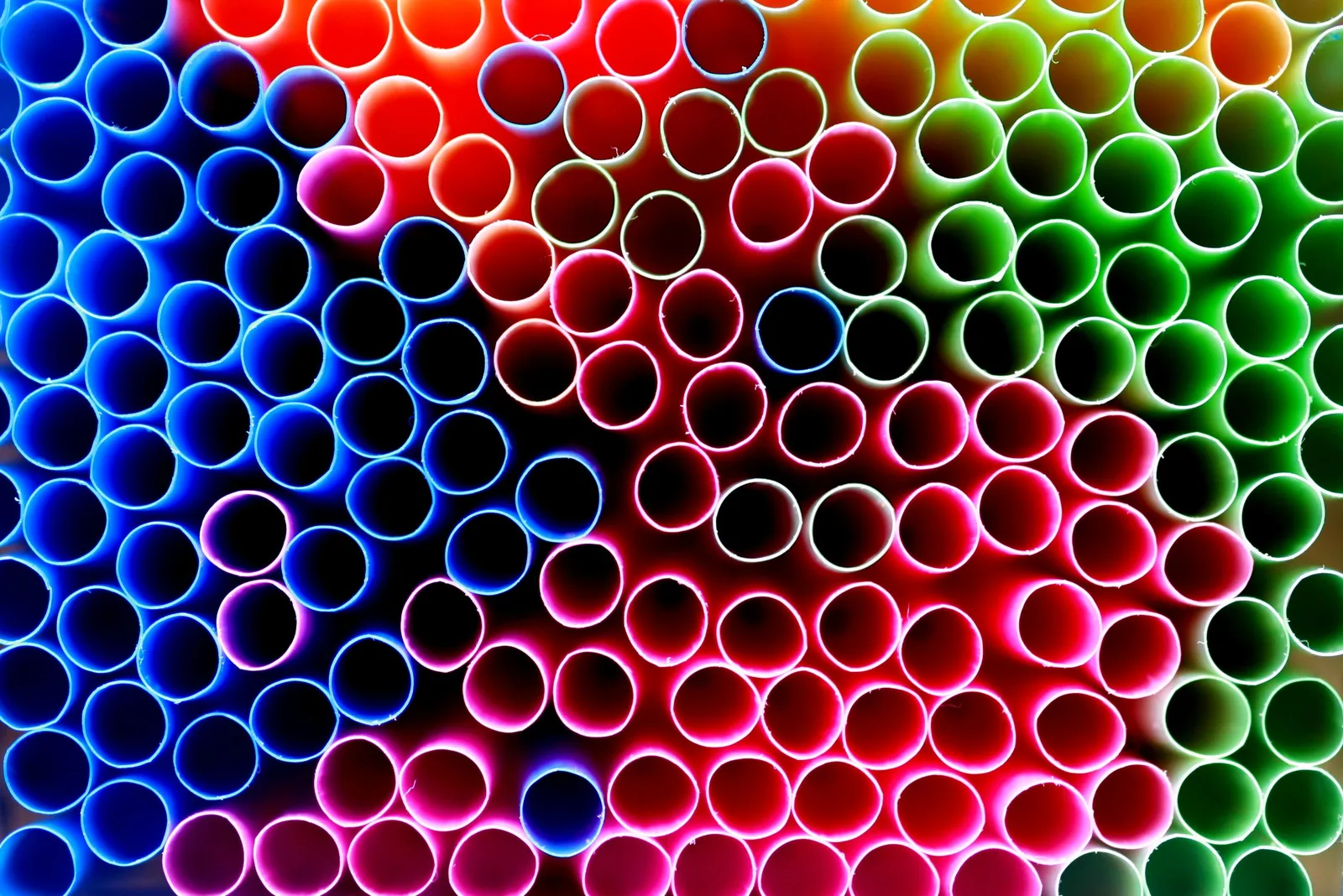 A close-up of colourful drinking straws