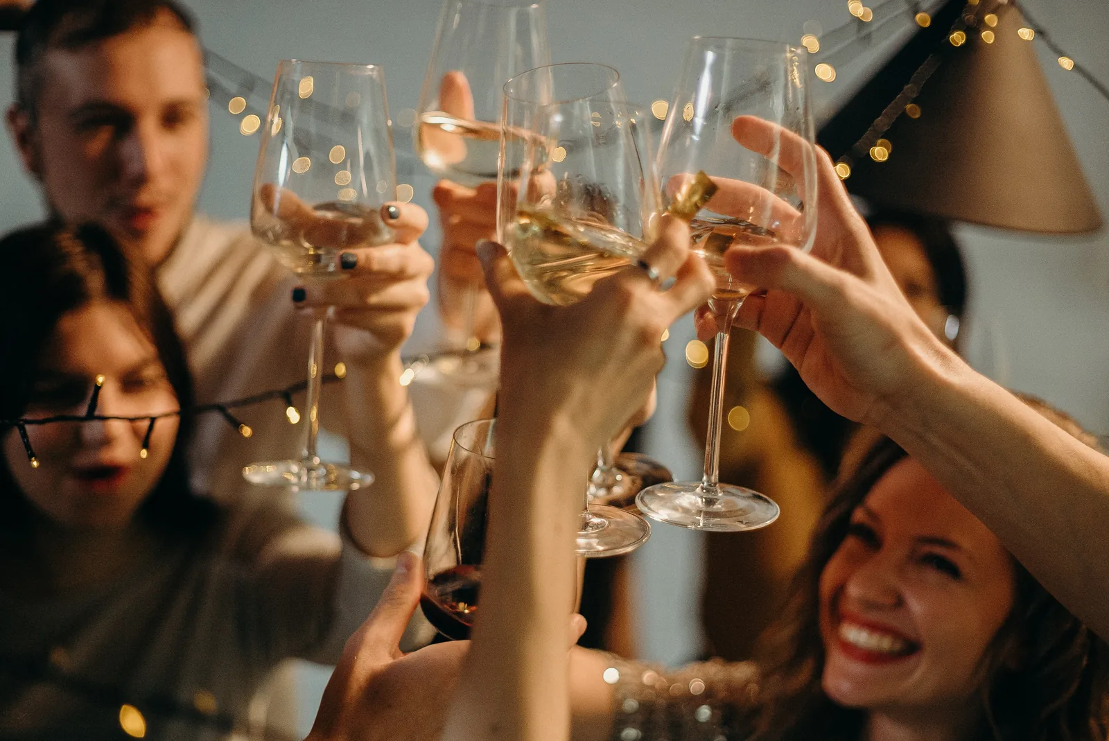 People raising glasses in a celebration