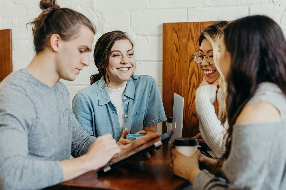 People talking together at a table